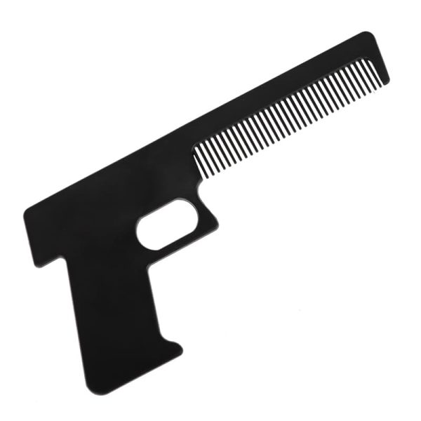 Черен гребен за коса във формата на пистолет.