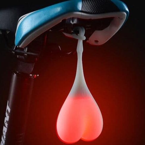 Предупредителна лампа за колело във формата на светещи топки.