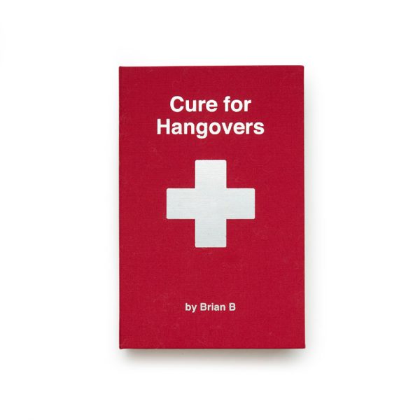 Малка червена книга с кръст и надпис Cure for hangovers със скрита вътре плоска джобна бутилка.